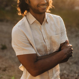 fit model smiling in the golden light in The Short Sleeve California in Natural Hemp