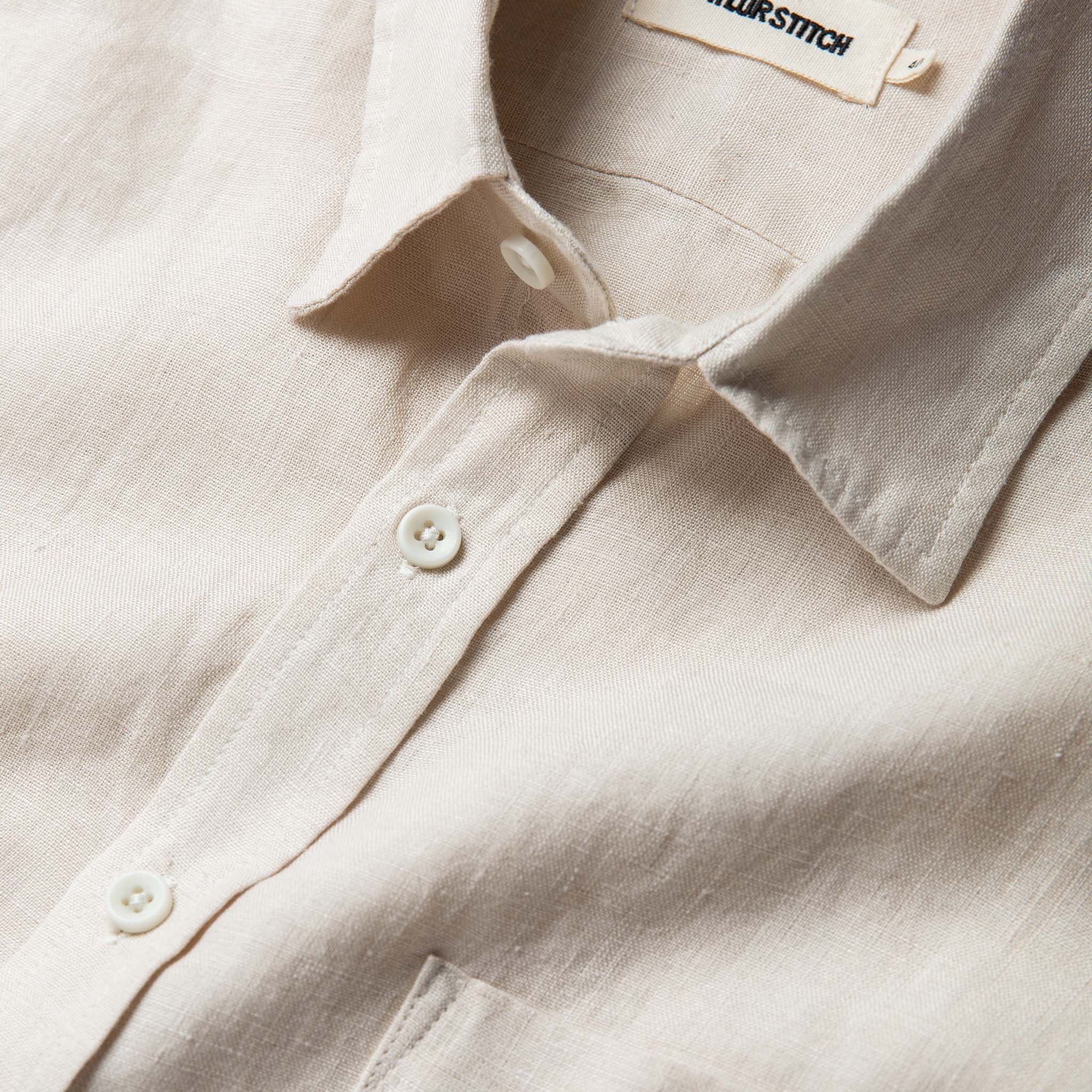 material shot of the collar and buttons on The Short Sleeve California in Natural Hemp, Wovens by Taylor Stitch