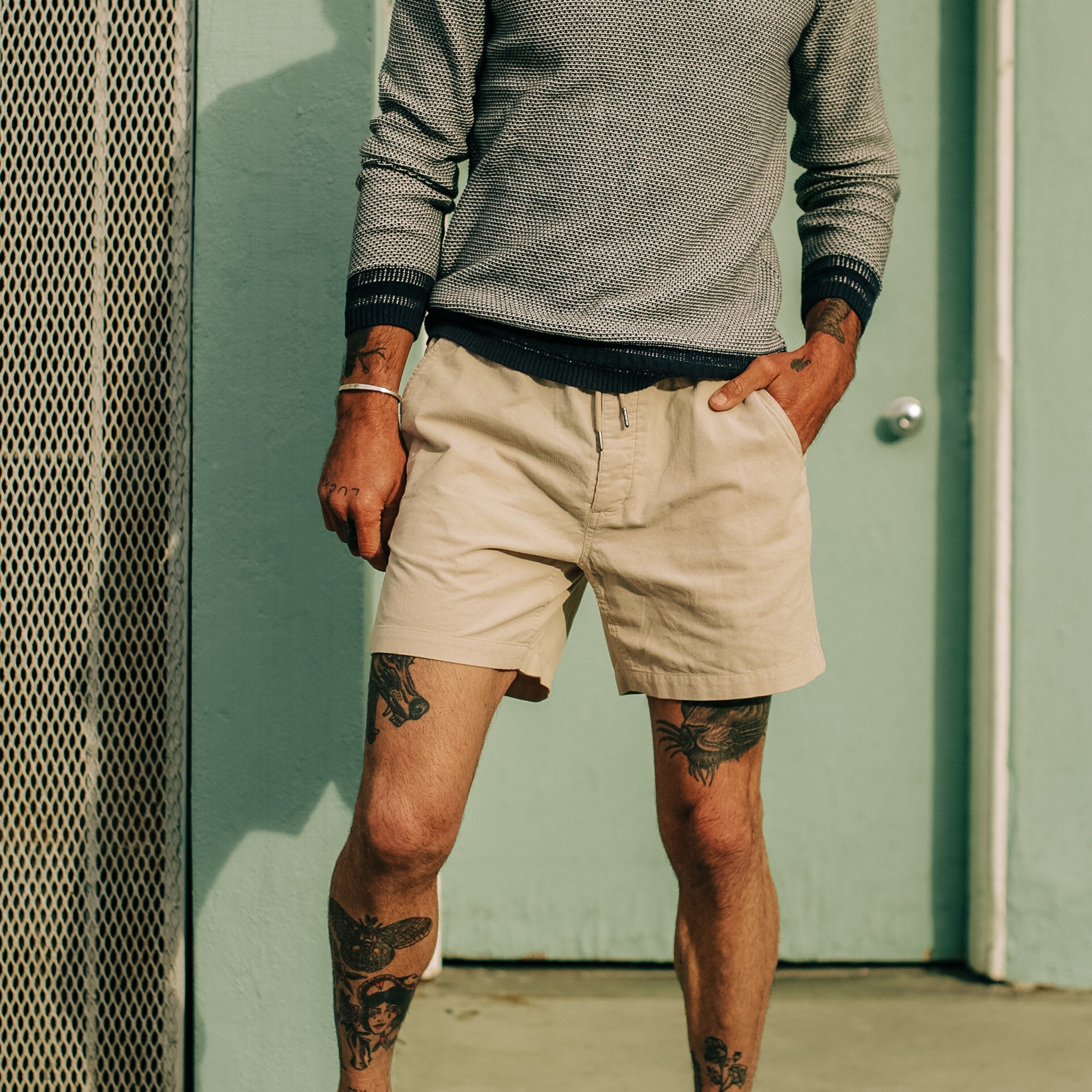 model standing in The Après Short in Natural Pinwale, Shorts by Taylor Stitch