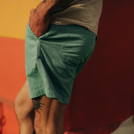 fit model posing in The Après Short in Ocean Pinwale with his hand in his pocket