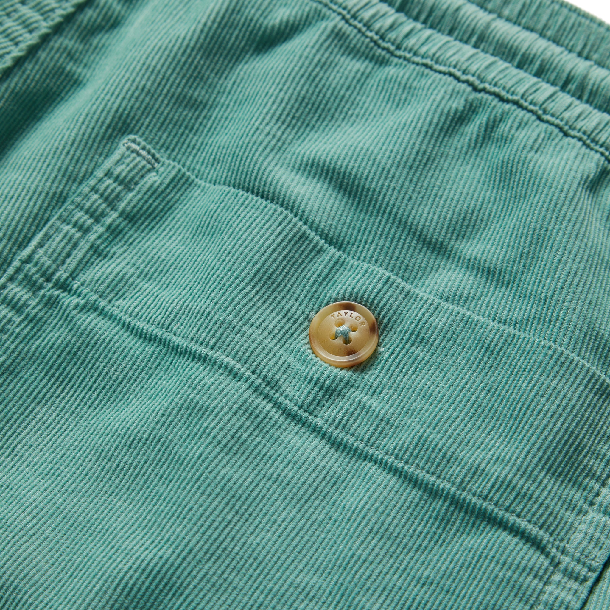 material shot of the back pocket on The Après Short in Ocean Pinwale, Shorts by Taylor Stitch