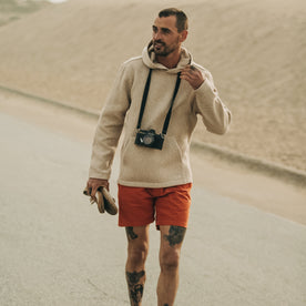 fit model walking in The Après Short in Rust Pinwale with a camera around his neck