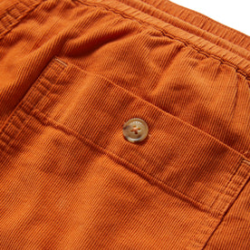 material shot of the back pocket on The Après Short in Rust Pinwale