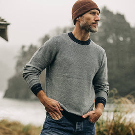 fit model with hands in pocket while wearing The Brume Sweater in Navy Birdseye