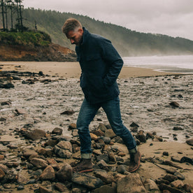 fit model wearing The Chandler Jacket in Navy Donegal along the shore