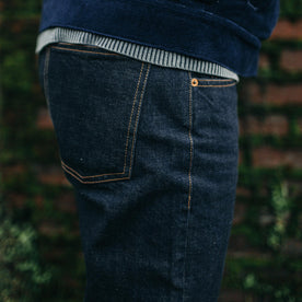 fit model showing back pocket of The Democratic Jean in Rinsed Organic Selvage