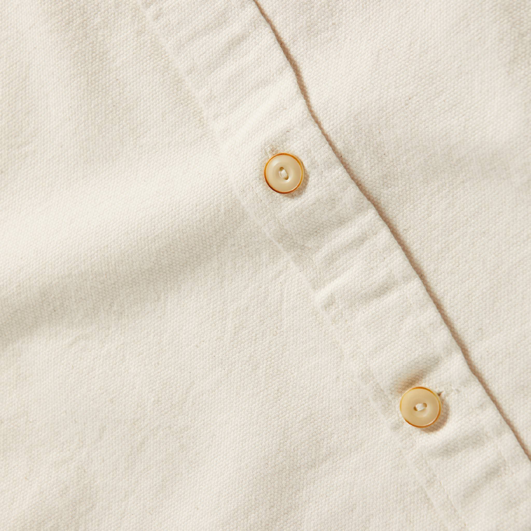 material shot of the buttons on The Division Shirt in Natural Selvage, Wovens by Taylor Stitch
