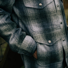 fit model with hand in the front pockets of The Forester Jacket in Ash Plaid