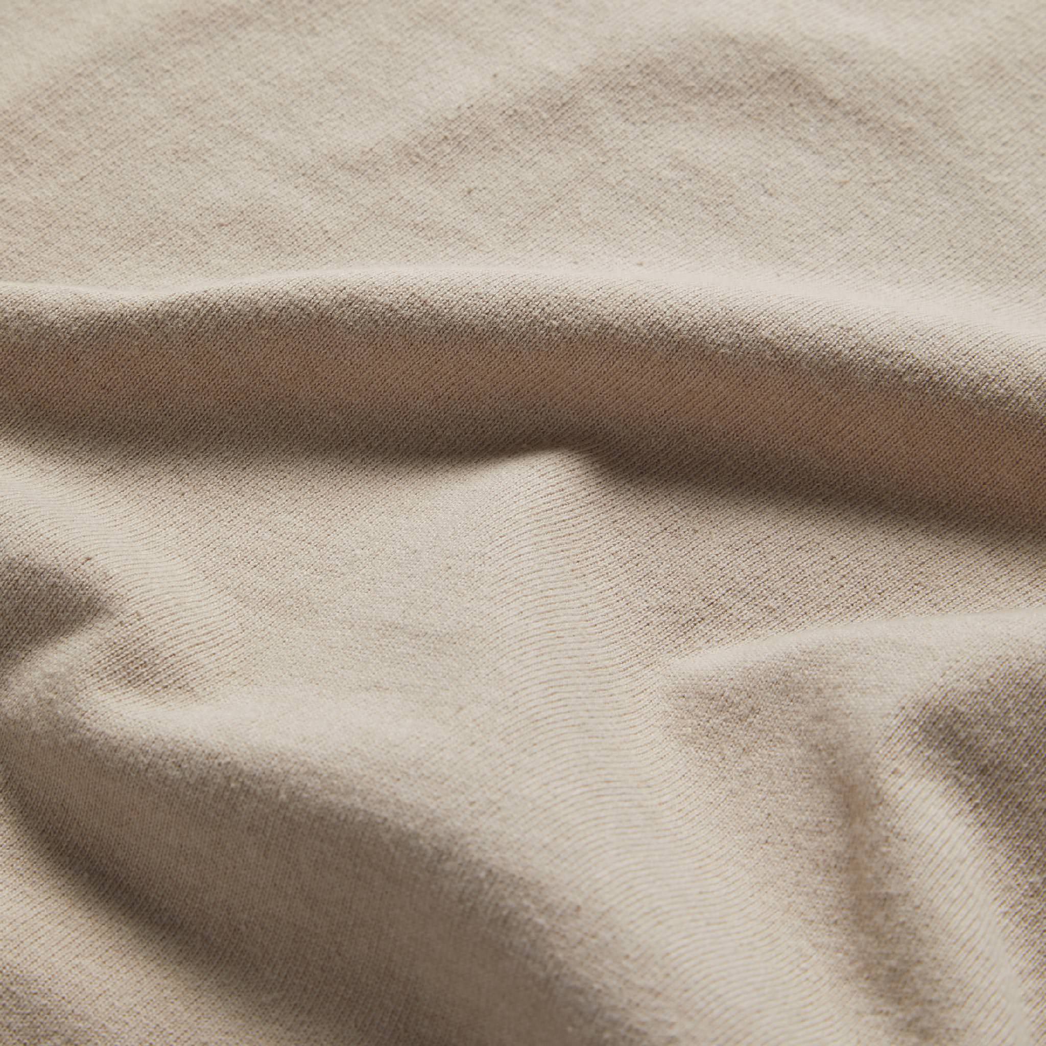 material shot of the fabric on The Short Sleeve Heavy Bag Henley in Sand, Knits by Taylor Stitch