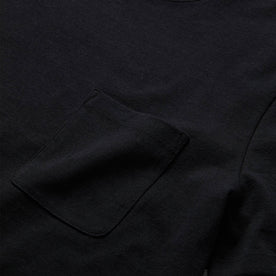 material shot of the pocket detail on The Heavy Bag Tee in Black