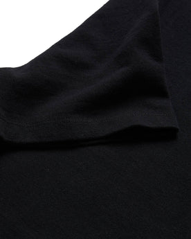 material shot of the sleeve on The Heavy Bag Tee in Black, Knits by Taylor Stitch