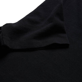 material shot of the sleeve on The Heavy Bag Tee in Black