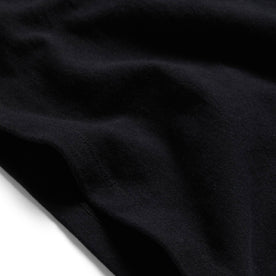material shot of the edges on The Heavy Bag Tee in Black