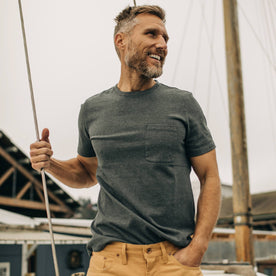 fit model wearing The Heavy Bag Tee in Dark Slate while holding a sailboat line