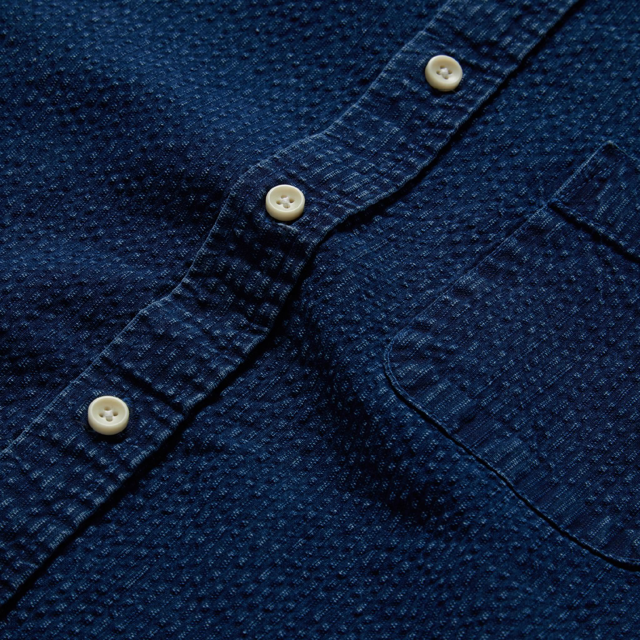 material shot of the buttons on The Short Sleeve Jack in Indigo Seersucker, Wovens by Taylor Stitch