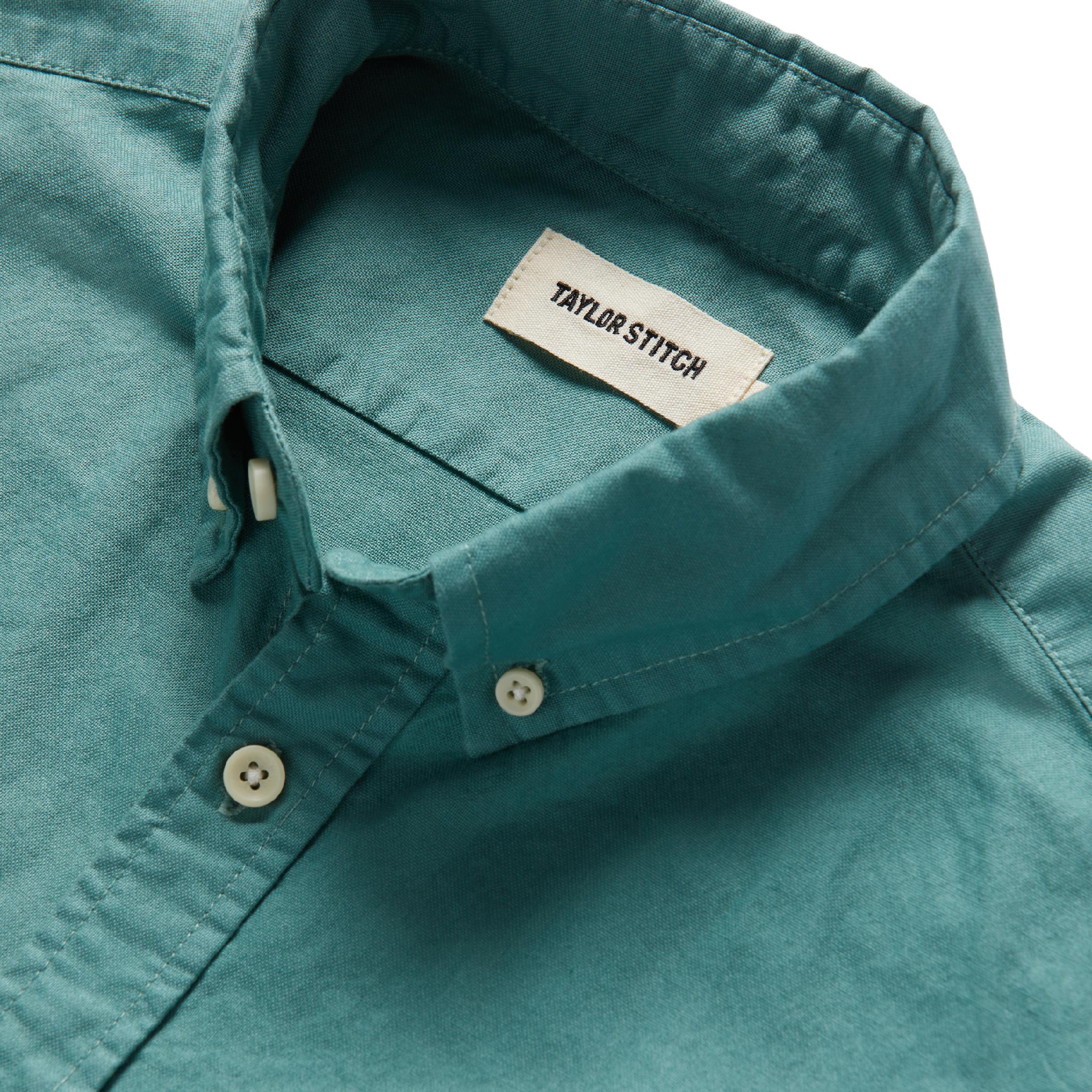 material shot of interior label of The Jack in Teal Oxford, Wovens by Taylor Stitch