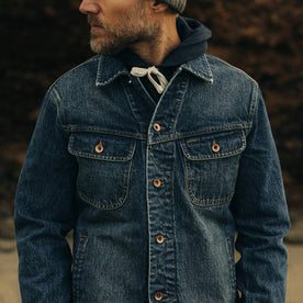 fit model showing The Long Haul Jacket in Sawyer Wash Organic Selvage worn over a hoodie