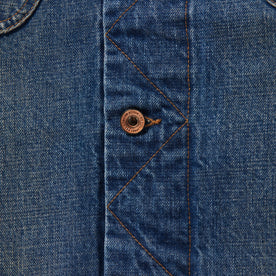 material shot of button on the stitched placket of The Long Haul Jacket in Sawyer Wash Organic Selvage