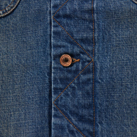 material shot of button on the stitched placket of The Long Haul Jacket in Sawyer Wash Organic Selvage