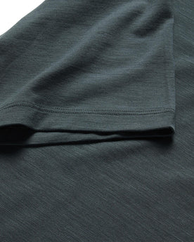 material shot of the sleeves on The Merino Tee in Dark Slate, Knits by Taylor Stitch