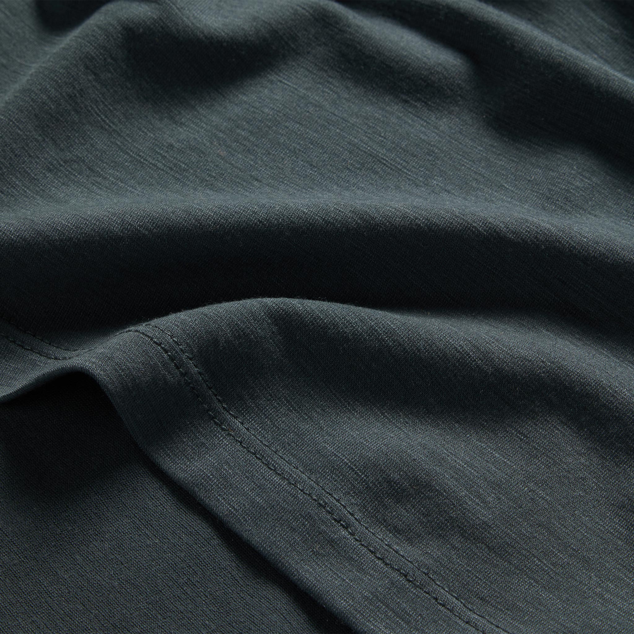 material shot of the hem on The Merino Tee in Dark Slate, Knits by Taylor Stitch