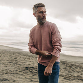 fit model wearing The Moor Sweater in Dusty Rose on the beach