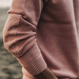 fit model showing reinforced sleeve of The Moor Sweater in Dusty Rose