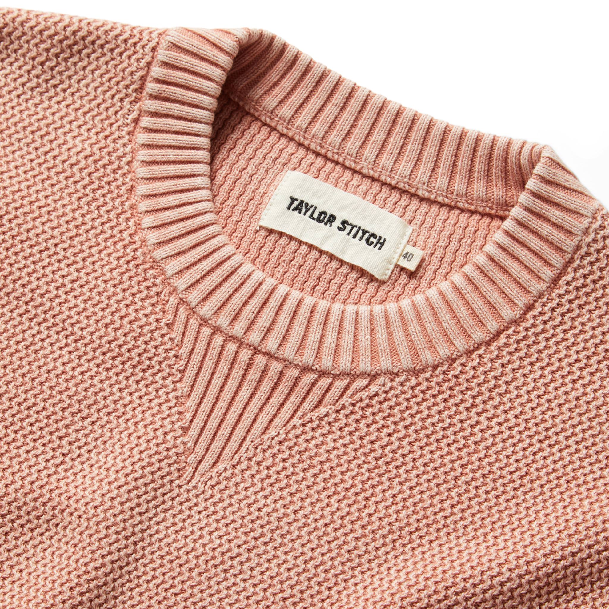 material shot showing interior label of The Moor Sweater in Dusty Rose, Knits by Taylor Stitch
