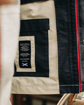 Material shot of the interior of The Navigator Jacket in Natural and Navy Colorblock, Outerwear by Taylor Stitch
