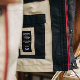 Material shot of the interior of The Navigator Jacket in Natural and Navy Colorblock