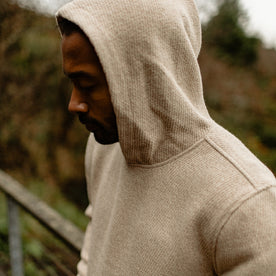 fit model wearing The Nomad Hoodie in Flax Twill with the hood up