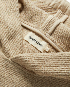 material shot of the label on The Nomad Hoodie in Flax Twill, Knits by Taylor Stitch