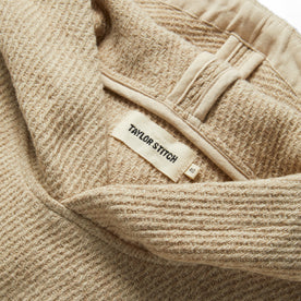material shot of the label on The Nomad Hoodie in Flax Twill