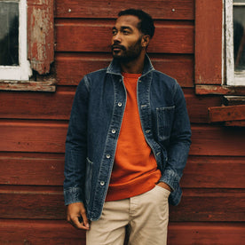 fit model wearing The Ojai Jacket in Sawyer Wash Selvage beside a barn