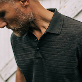 fit model showing collar of The Polo in Dark Charcoal Jacquard
