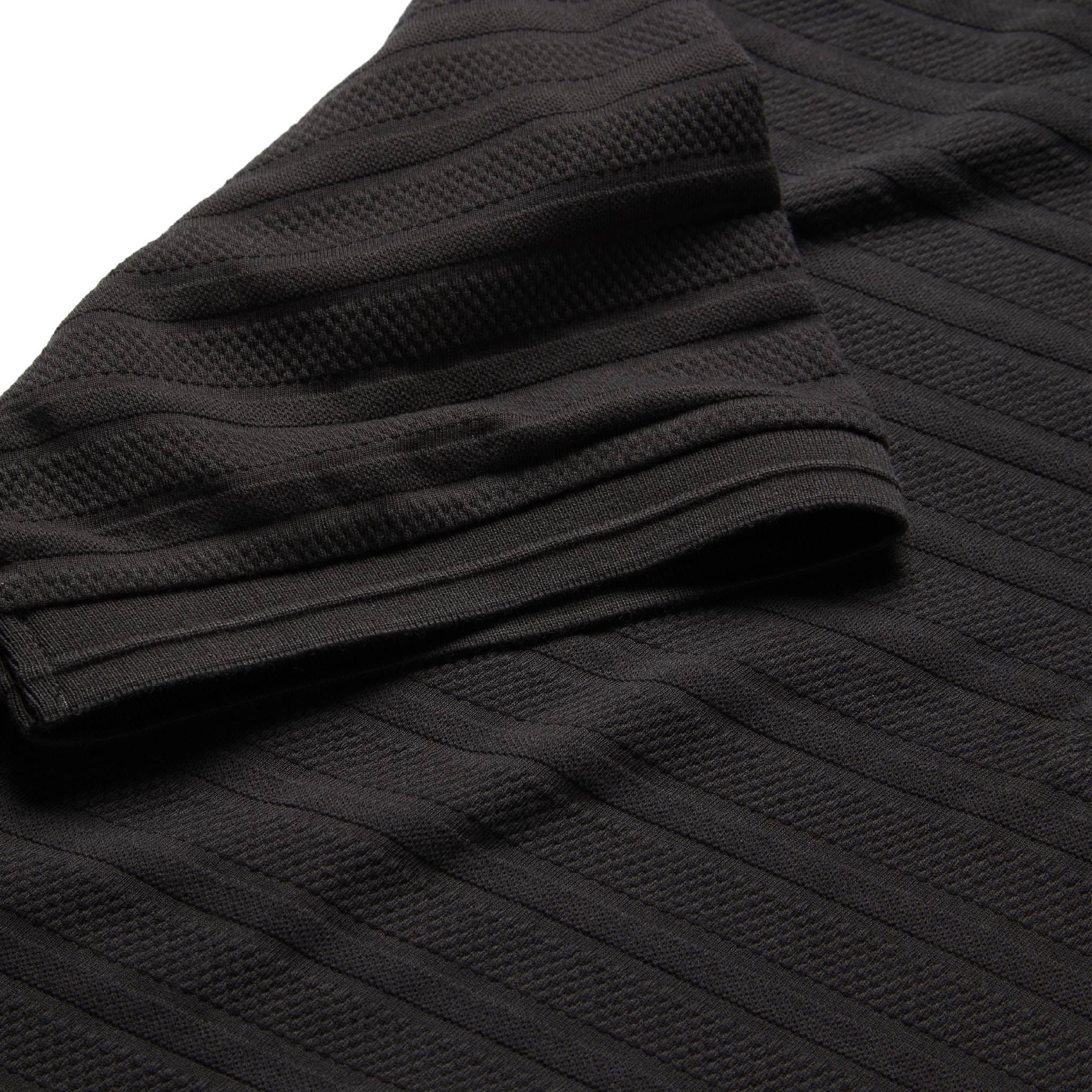 material shot of ribbed sleeve hem of The Polo in Dark Charcoal Jacquard, Knits by Taylor Stitch