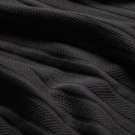 material shot of texted fabric of The Polo in Dark Charcoal Jacquard