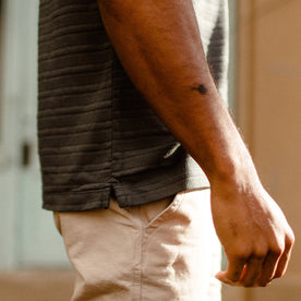 fit model showing side hem of The Polo in Dark Slate Jacquard