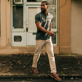 fit model crossing the street in The Polo in Dark Slate Jacquard