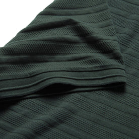 material shot of sleeve hem of The Polo in Dark Slate Jacquard