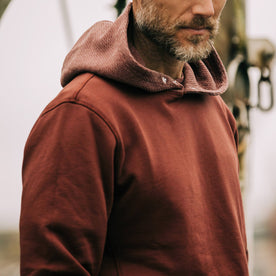 fit model showing right sleeve of The Shackleton Hoodie in Russet