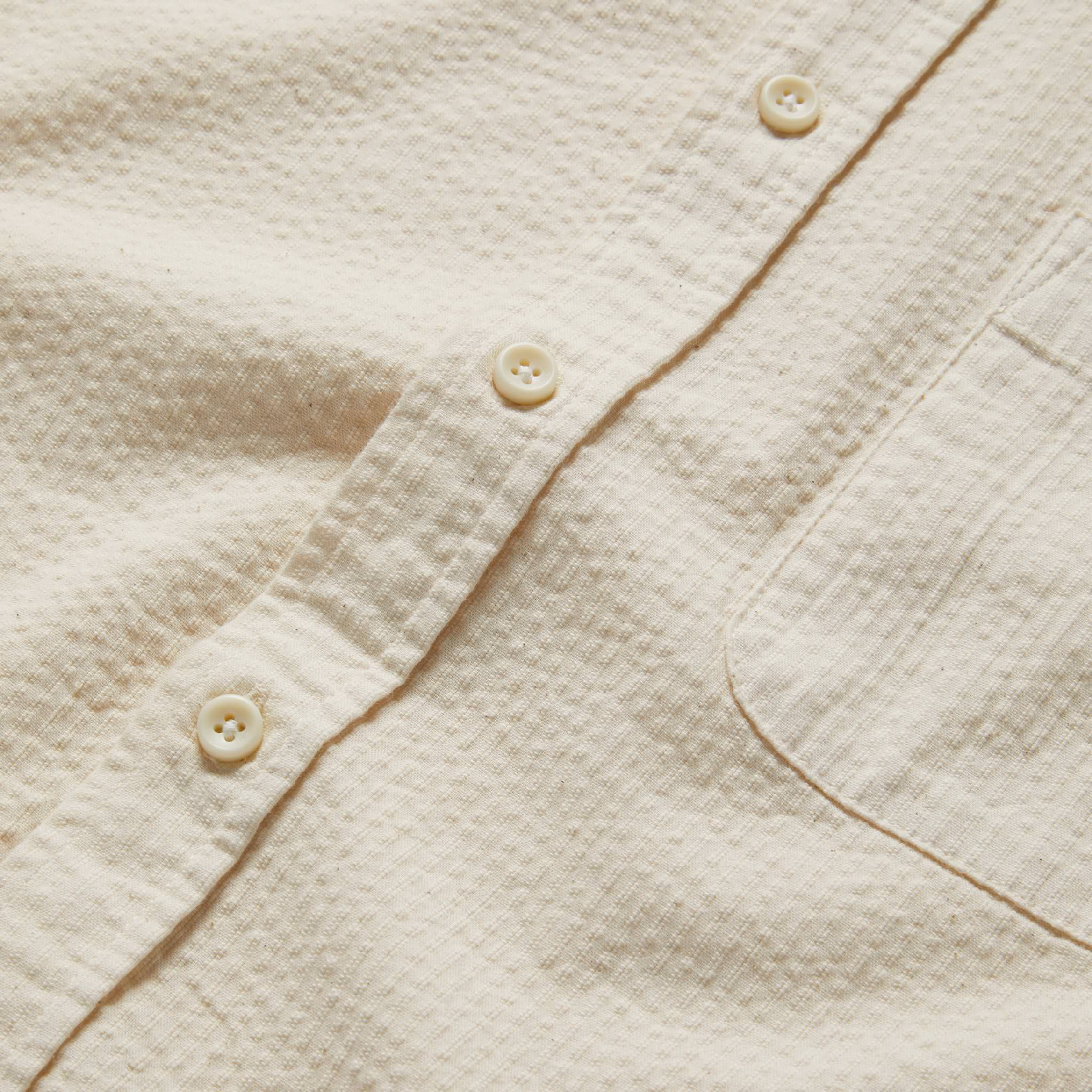 material shot of the buttons on The Short Sleeve Jack in Natural Seersucker, Wovens by Taylor Stitch