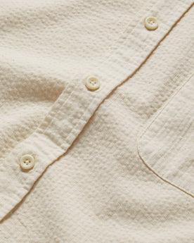 material shot of the buttons on The Short Sleeve Jack in Natural Seersucker, Wovens by Taylor Stitch