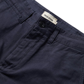 material shot of the button fly of The Slim Foundation Pant in Dark Navy