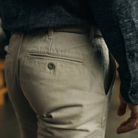 fit model showing back pocket of The Slim Foundation Pant in Organic Stone