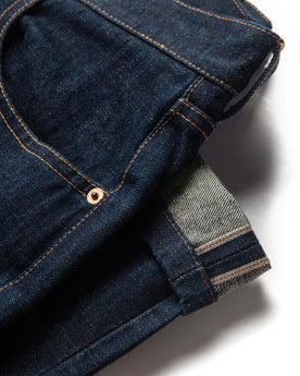 material shot of selvage leg hem of The Slim Jean in Rinsed Organic Selvage, Bottoms by Taylor Stitch