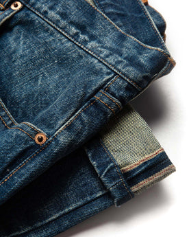 material shot of selvage hem of The Slim Jean in Sawyer Wash Organic Selvage, Bottoms by Taylor Stitch