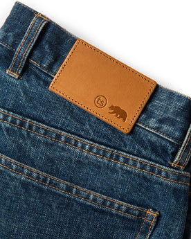 material shot of leather patch of The Slim Jean in Sawyer Wash Organic Selvage, Bottoms by Taylor Stitch