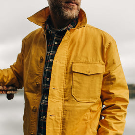 fit model wearing The Watts Jacket in Canary over a plaid shirt