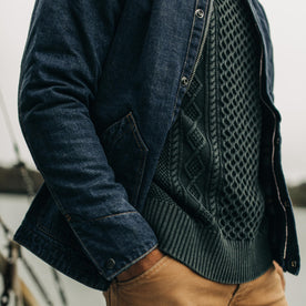 our fit model with hands in pockets wearing The Workhorse Jacket in Marlowe Wash Denim over our Orr Sweater
